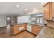 Updated kitchen featuring granite countertops, wood cabinetry, and stainless steel appliances at 17 Bellevue Dr, Treasure Island, FL 33706