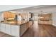 Open-concept kitchen featuring wood floors, granite countertops, and modern appliances at 17 Bellevue Dr, Treasure Island, FL 33706