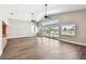 Bright living room with high ceilings, wood floors and sliding glass doors to the pool at 17 Bellevue Dr, Treasure Island, FL 33706