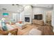 Comfortable living room with vaulted ceilings, fireplace, and neutral decor creating a relaxing atmosphere at 17 Bellevue Dr, Treasure Island, FL 33706