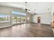 Bright living room with high ceilings, wood floors and sliding glass doors to the pool at 17 Bellevue Dr, Treasure Island, FL 33706