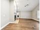 Bright living room with hardwood floors, a fireplace, high ceilings, and neutral paint at 17 Bellevue Dr, Treasure Island, FL 33706