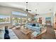 Bright living room with water view, vaulted ceilings, ceiling fans and comfortable seating at 17 Bellevue Dr, Treasure Island, FL 33706