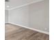 The living room has neutral walls and wood-look flooring at 17 Bellevue Dr, Treasure Island, FL 33706