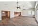 Spacious living room with vaulted ceilings, wood floors, and open floor plan at 17 Bellevue Dr, Treasure Island, FL 33706