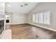 Bright living room with hardwood floors, a fireplace, high ceilings, and neutral paint at 17 Bellevue Dr, Treasure Island, FL 33706