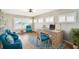 Bright office space with desk, three side chairs, a ceiling fan and light hardwood floors at 17 Bellevue Dr, Treasure Island, FL 33706