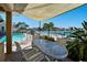 Outdoor patio featuring canal views, a shaded area, a table and chairs at 17 Bellevue Dr, Treasure Island, FL 33706
