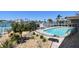 Backyard featuring a fenced pool and lush landscaping near the waterfront at 17 Bellevue Dr, Treasure Island, FL 33706