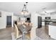 Open-concept dining area offering seamless flow to the living room and kitchen for easy entertaining at 1710 Hibiscus N Cir, Oldsmar, FL 34677