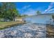 View of the driveway and two-car garage with well maintained lawn at 1710 Hibiscus N Cir, Oldsmar, FL 34677