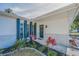 Inviting front door with black door, columns and landscaping at 1710 Hibiscus N Cir, Oldsmar, FL 34677