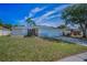 Charming single-Gathering home featuring a well-maintained lawn, a two-car garage, and beautiful landscaping at 1710 Hibiscus N Cir, Oldsmar, FL 34677