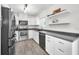 Well-appointed kitchen featuring stainless steel appliances, sleek countertops, and ample cabinet space at 1710 Hibiscus N Cir, Oldsmar, FL 34677