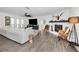 Bright living room featuring a decorative fireplace, and light wood floors at 1710 Hibiscus N Cir, Oldsmar, FL 34677