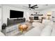 Inviting living room showcasing a fireplace, sleek entertainment center, comfortable seating, and stylish decor at 1710 Hibiscus N Cir, Oldsmar, FL 34677