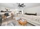 Spacious living room featuring a fireplace, comfortable seating, and modern decor for relaxation and entertainment at 1710 Hibiscus N Cir, Oldsmar, FL 34677