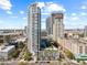 Stunning aerial view of a modern high-rise with a rooftop pool, showcasing the city skyline at 175 1St S St # 2603, St Petersburg, FL 33701