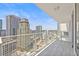 Modern glass-enclosed balcony highlighting stunning panoramic city views from a high-rise condo at 175 1St S St # 2603, St Petersburg, FL 33701