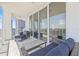Inviting balcony features contemporary furnishings with views of city skyscrapers and clear blue skies at 175 1St S St # 2603, St Petersburg, FL 33701