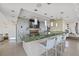 Modern bar area featuring a stunning green marble counter, pendant lighting, and a wall-mounted television at 175 1St S St # 2603, St Petersburg, FL 33701