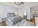 This bedroom includes hardwood floors, a stylish ceiling fan, and elegant lighting at 175 1St S St # 2603, St Petersburg, FL 33701