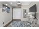 This bedroom features a modern ceiling fan, hardwood floors and a large painting at 175 1St S St # 2603, St Petersburg, FL 33701