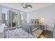 This bedroom boasts large windows with great city views, ceiling fan and modern decor at 175 1St S St # 2603, St Petersburg, FL 33701