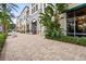 Attractive storefront with well-maintained landscaping and brick walkway, creating curb appeal at 175 1St S St # 2603, St Petersburg, FL 33701