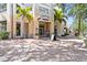 Charming building facade with storefronts and palm trees, creating a welcoming atmosphere at 175 1St S St # 2603, St Petersburg, FL 33701