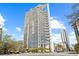 Modern high-rise condo with sleek architecture against a clear blue sky at 175 1St S St # 2603, St Petersburg, FL 33701
