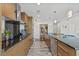 Stylish kitchen featuring modern appliances, wooden cabinets, and a view into the open-plan living area at 175 1St S St # 2603, St Petersburg, FL 33701