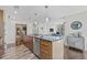 Kitchen island featuring stainless steel appliances and views of the building's open-plan living space at 175 1St S St # 2603, St Petersburg, FL 33701