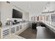 Modern kitchenette with stainless steel appliances, white cabinets, and a view of the city at 175 1St S St # 2603, St Petersburg, FL 33701