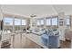 Bright and airy living room with stylish seating, large windows, and balcony access at 175 1St S St # 2603, St Petersburg, FL 33701