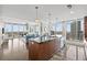 Open-concept living space with floor-to-ceiling windows, hardwood floors, and a gourmet kitchen at 175 1St S St # 2603, St Petersburg, FL 33701