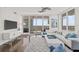 Inviting living room with plush seating, modern decor, and city views at 175 1St S St # 2603, St Petersburg, FL 33701