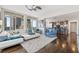 Expansive living room boasting floor-to-ceiling windows, hardwood flooring, and a stylish open-concept layout at 175 1St S St # 2603, St Petersburg, FL 33701