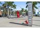 View of a public pier with palm trees and an abstract pelican statue at 175 1St S St # 2603, St Petersburg, FL 33701