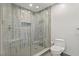 Elegant glass shower featuring a built-in bench and sophisticated tile design at 175 1St S St # 2603, St Petersburg, FL 33701