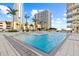 Stunning outdoor pool with palm trees, poolside seating, and views of the city skyline at 175 1St S St # 2603, St Petersburg, FL 33701