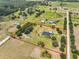 Expansive property with estate home, barn, pool, and boundary highlighted in red at 18423 Lithia Towne Rd, Lithia, FL 33547