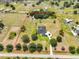 Aerial view of large lot with estate home, pool, landscaping, outlined in red at 18423 Lithia Towne Rd, Lithia, FL 33547