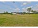 Expansive backyard with a screened-in patio area, ideal for outdoor relaxation at 18423 Lithia Towne Rd, Lithia, FL 33547