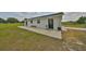 Side view of the home, showing the exterior design with the windows and doors at 18423 Lithia Towne Rd, Lithia, FL 33547