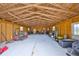 A spacious garage with high ceilings and ample storage and workspace at 18423 Lithia Towne Rd, Lithia, FL 33547