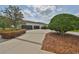 View of the garage doors at 18423 Lithia Towne Rd, Lithia, FL 33547