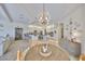Open floor plan of a dining area with a cabinet leading into the kitchen at 18423 Lithia Towne Rd, Lithia, FL 33547