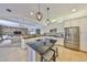 Spacious kitchen featuring stainless steel appliances, a central island, and granite countertops at 18423 Lithia Towne Rd, Lithia, FL 33547