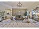 Comfortable living room with fireplace, stylish decor, and plenty of natural light at 18423 Lithia Towne Rd, Lithia, FL 33547